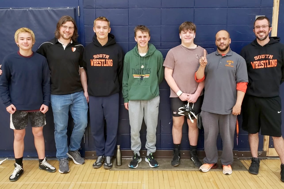 Eli Stottrup (third from left) and Matthew O’hara Jr (fourth from left) pictured with teammates and coaches after advancing to the state tournament. Photo courtesy of: Jennifer Fukuda